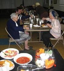 A Grange Public Dinner or a  Pot Luck supper,  the image is like this. Good people, good food, good conversations.